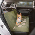 Load image into Gallery viewer, Dog sitting on a green car hammock in a vehicle