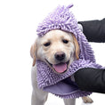 Load image into Gallery viewer, Dog wrapped in a purple towel with a white background
